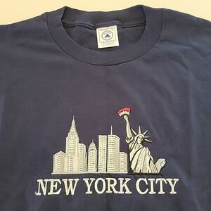 Vintage 1990's New York City Embroidered Twin Towers T-shirt Size L Blue Delta